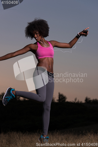 Image of black woman is doing stretching exercise relaxing and warm up