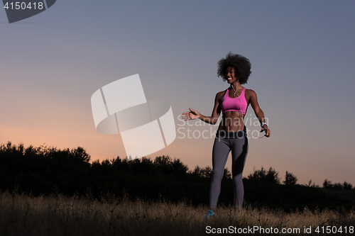 Image of black woman is doing stretching exercise relaxing and warm up