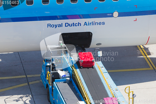 Image of AMSTERDAM, NETHERLANDS - AUGUST 17, 2016: Loading luggage in air