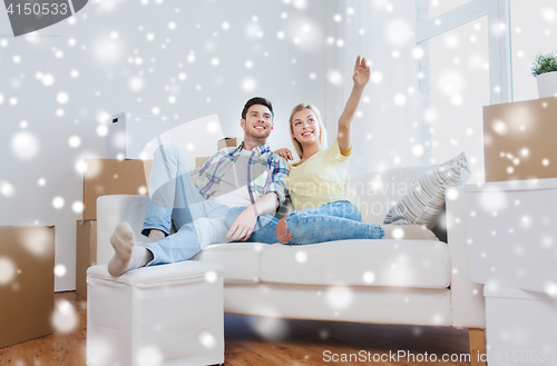 Image of couple with boxes moving to new home and dreaming