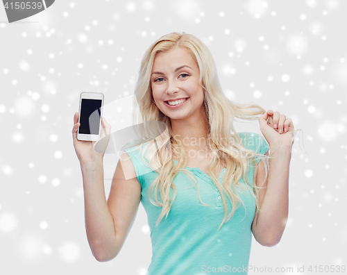 Image of happy young woman or teenage girl with smartphone