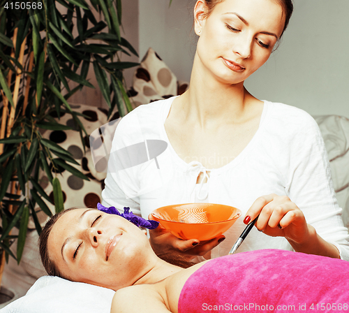 Image of stock photo attractive lady getting spa treatment in salon, heal