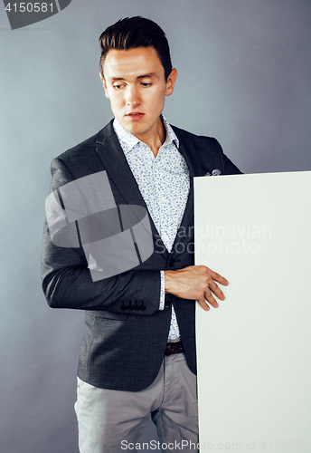 Image of young pretty business man standing on white background, modern hairstyle, posing emotional, lifestyle people concept