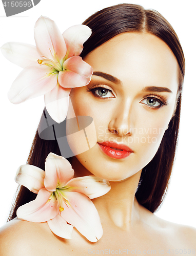 Image of young attractive lady close up with hands on face isolated flowe