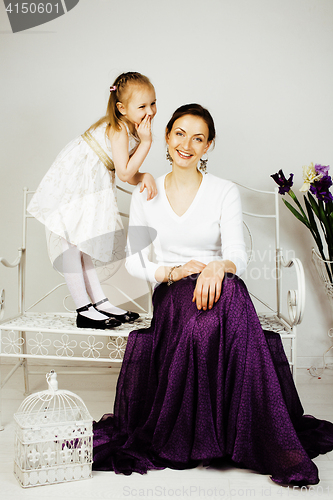 Image of young mother with daughter at luxury home interior vintage