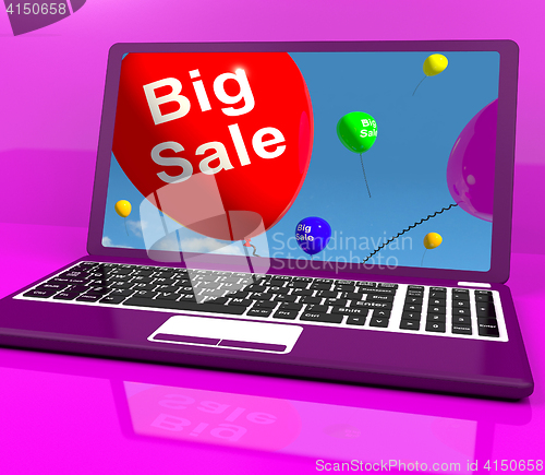 Image of Big Sale Balloon On Laptop Shows Online Discounts