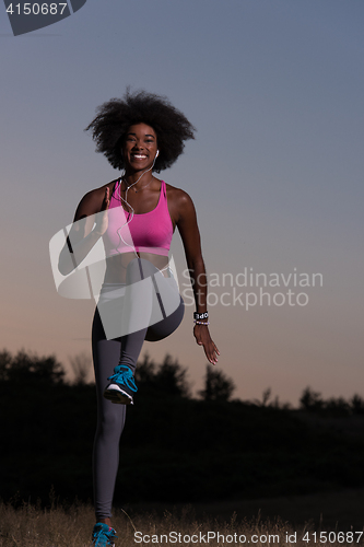 Image of black woman is doing stretching exercise relaxing and warm up