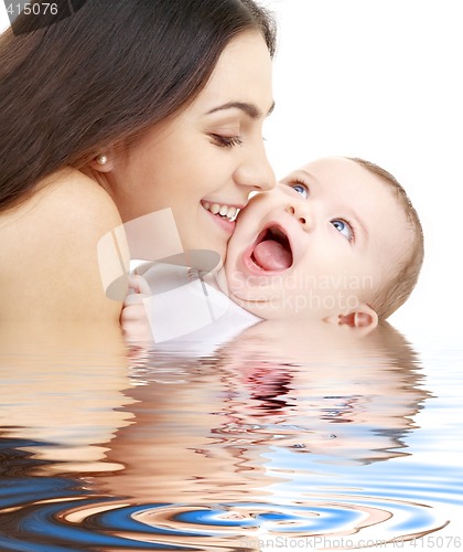 Image of playful mama with happy baby in water