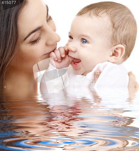 Image of bathing baby in mother hands