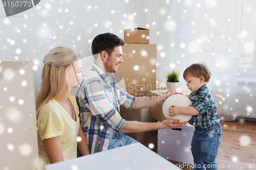 Image of happy family moving to new home and playing ball