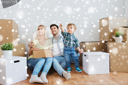 Image of happy family with boxes moving to new home