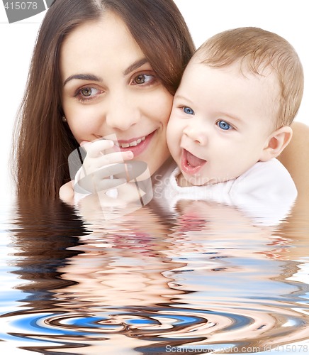 Image of bathing baby in mother hands