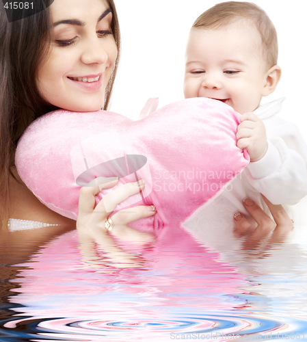 Image of baby and mama with heart-shaped pillow