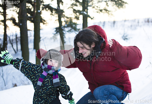 Image of young happy father with his son little cute boy outside in winter park, lifestyle people concept