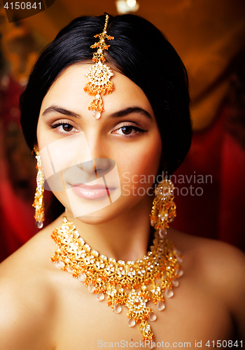 Image of beauty sweet real indian girl in sari smiling on black backgroun