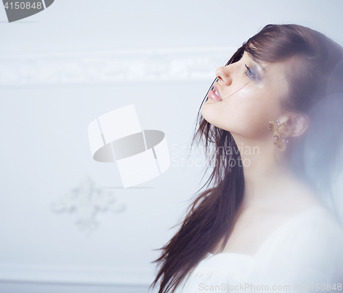 Image of beauty young brunette sad woman close up,real spa hair on face inspiring