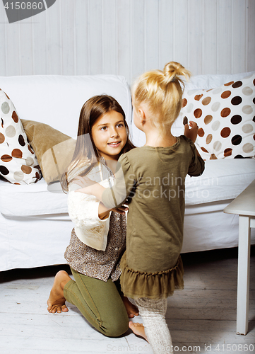 Image of two cute sisters at home playing, little girl in house interior, lifestyle people concept