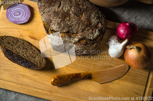 Image of Top view on homemade bread and onions