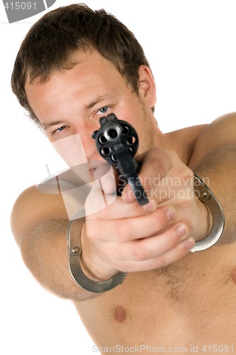 Image of The young man with a pistol. Isolated