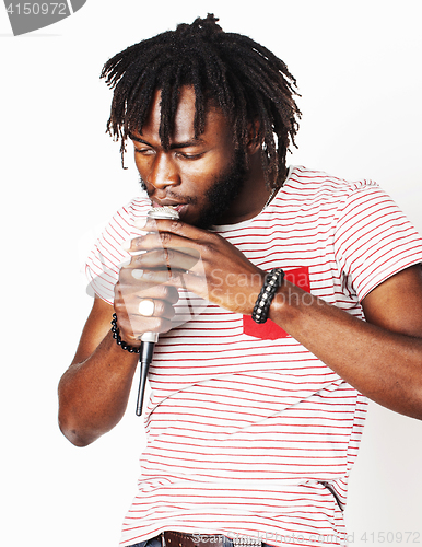 Image of young handsome african american boy singing emotional with microphone isolated on white background, in motion gesturing smiling, lifestyle people concept