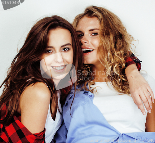 Image of two best friends teenage girls together having fun, posing emotional on white background, besties happy smiling, making selfie, lifestyle people concept