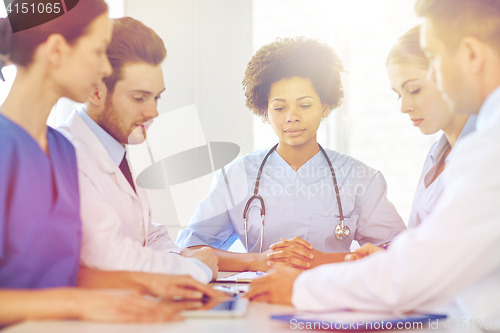 Image of group of happy doctors meeting at hospital office