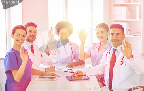 Image of group of happy doctors meeting at hospital office