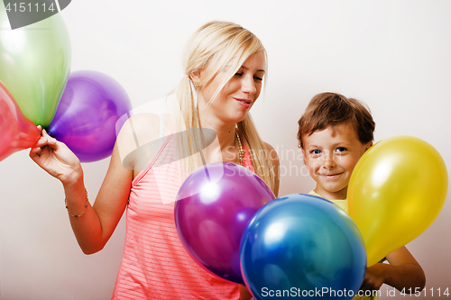 Image of pretty real family with color balloons on white background, blon