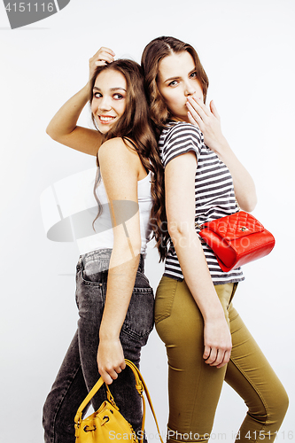 Image of two best friends teenage girls together having fun, posing emotional on white background, besties happy smiling, lifestyle people concept