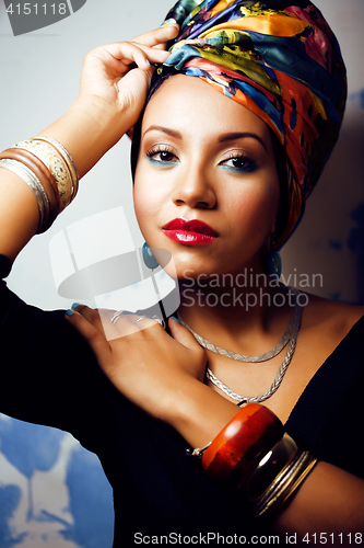 Image of beauty bright african woman with creative make up, shawl on head