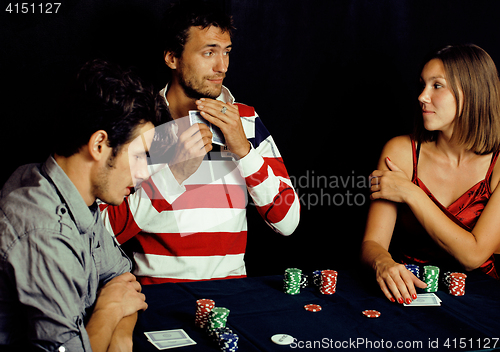 Image of young people playing poker off-line tournament, friends party co