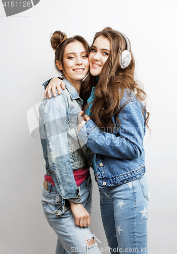 Image of lifestyle and people concept: Fashion portrait of two stylish sexy girls best friends, over white background. Happy time for fun.