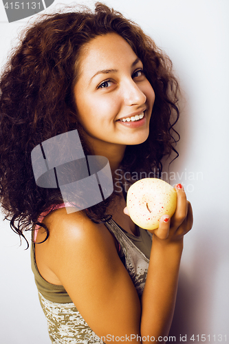 Image of pretty young real tenage girl eating apple close up smiling