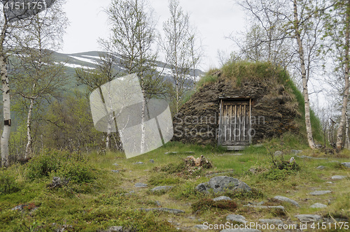 Image of A turf hut (darfegoahti) in a Sami Camp