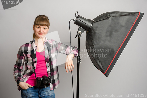 Image of Portrait of a girl the photographer at the studio softbox