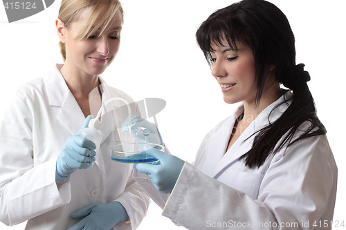 Image of Scientists with test tube, bottle and petri dish