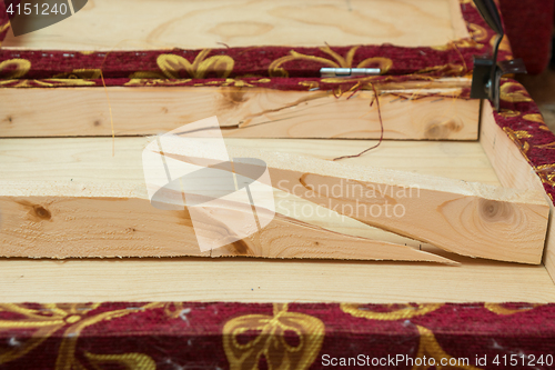 Image of Broken wooden beams - the edge of the sofa hardness