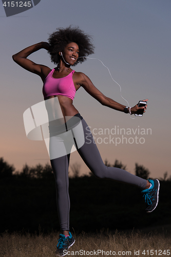 Image of black woman is doing stretching exercise relaxing and warm up