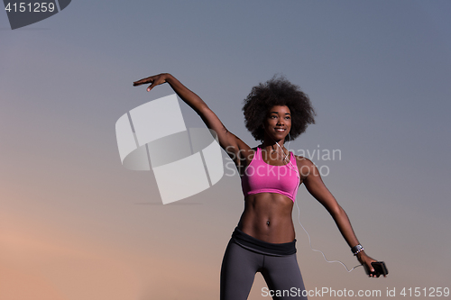Image of black woman is doing stretching exercise relaxing and warm up