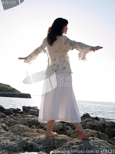 Image of Young Lady Dancing on Sea Shore