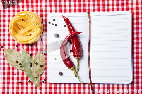 Image of blank paper with pasta, pepper and spices