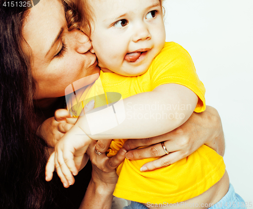 Image of pretty real fashion mother with cute blond little daughter close up isolated on white background, lifestyle people concept