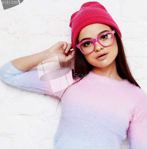 Image of pretty young teenage girl hipster in pink glasses and hat emotional posing happy smiling, lifestyle people concept