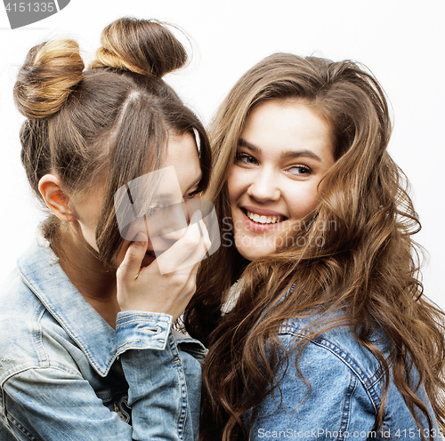 Image of lifestyle and people concept: Fashion portrait of two stylish sexy girls best friends, over white background. Happy time for fun.