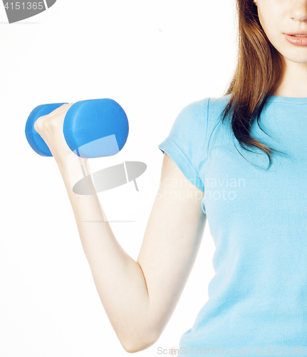 Image of young pretty slim womans hand with dumbbell isolated, real sport girl next door, lifestyle people concept