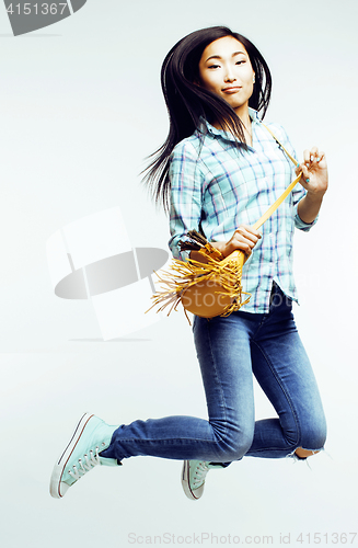 Image of young pretty jumping asian woman posing cheerful emotional isolated on white background, lifestyle people concept