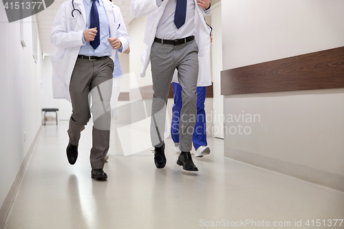 Image of close up of medics or doctors running at hospital