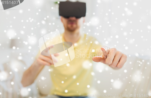 Image of young man in virtual reality headset or 3d glasses