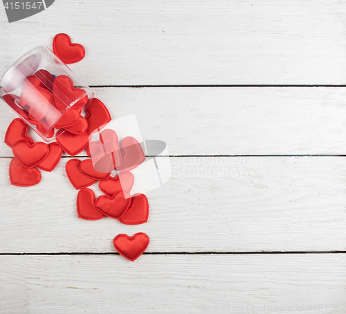 Image of Red hearts on a white wood background