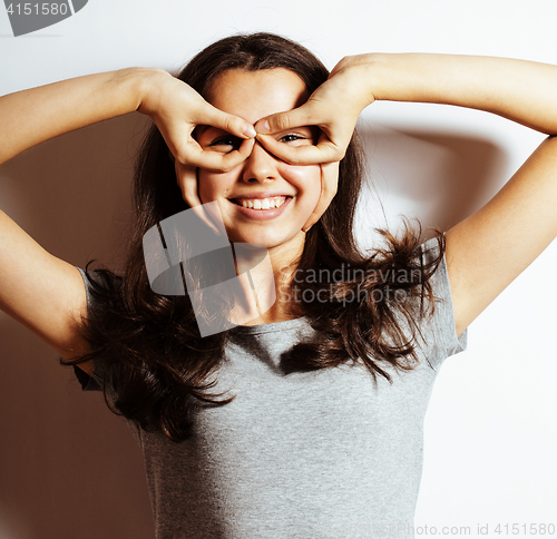 Image of young pretty girl on white background gesturing adorable